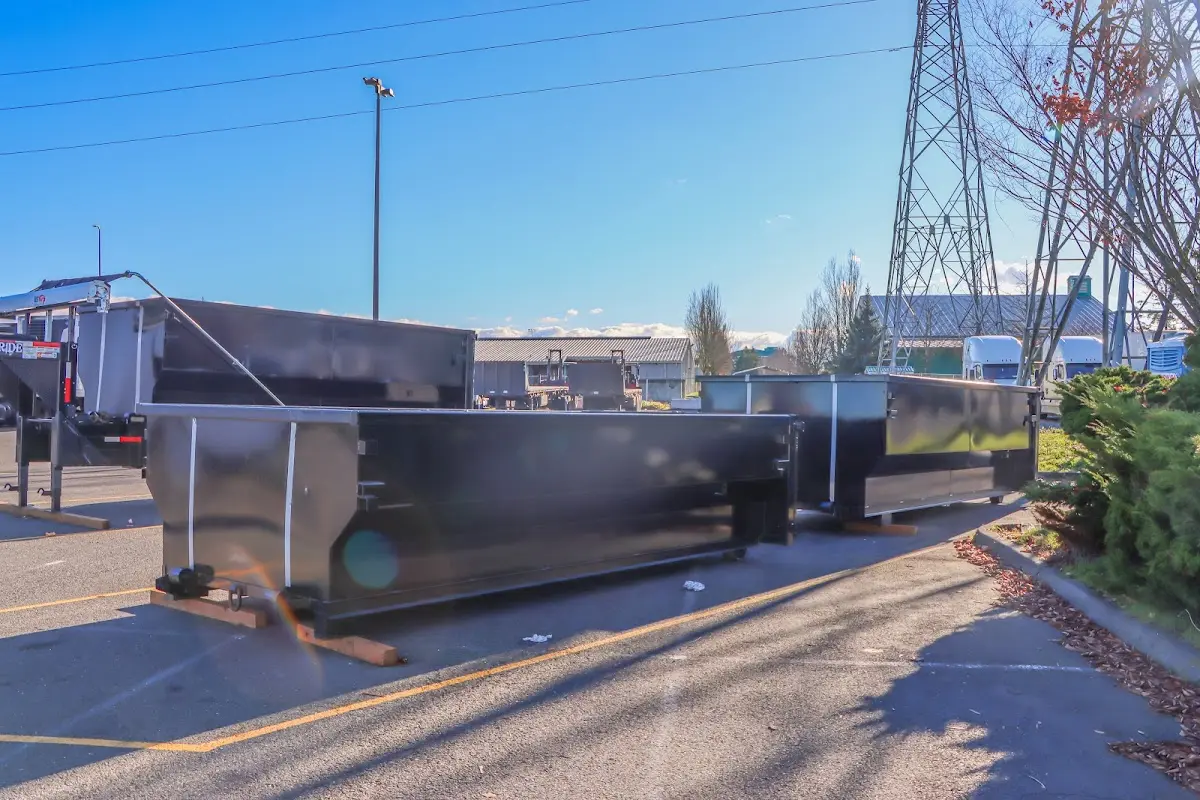 Roll-off dumpster ready for waste disposal at job site for 4 Yard Dumpster Rental in Peterborough